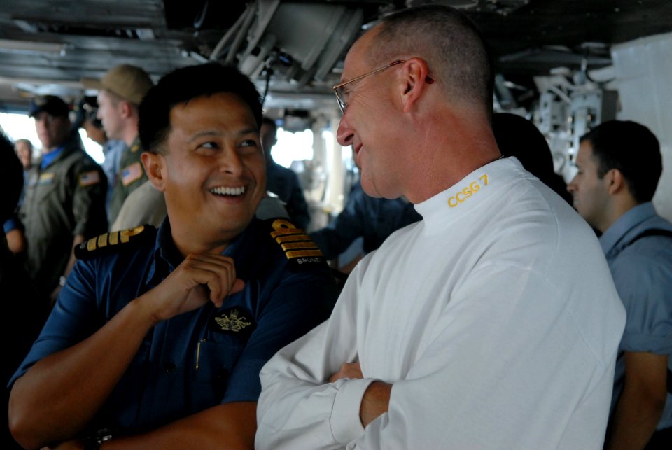 US Navy 081104-N-4005H-329 Rear Adm. Scott Hebner, commander of Carrier Strike Group 7, speaks with a member of the Brunei military during a tour of the bridge aboard the Nimitz-class aircraft carrier USS Ronald Reagan (CVN 76)