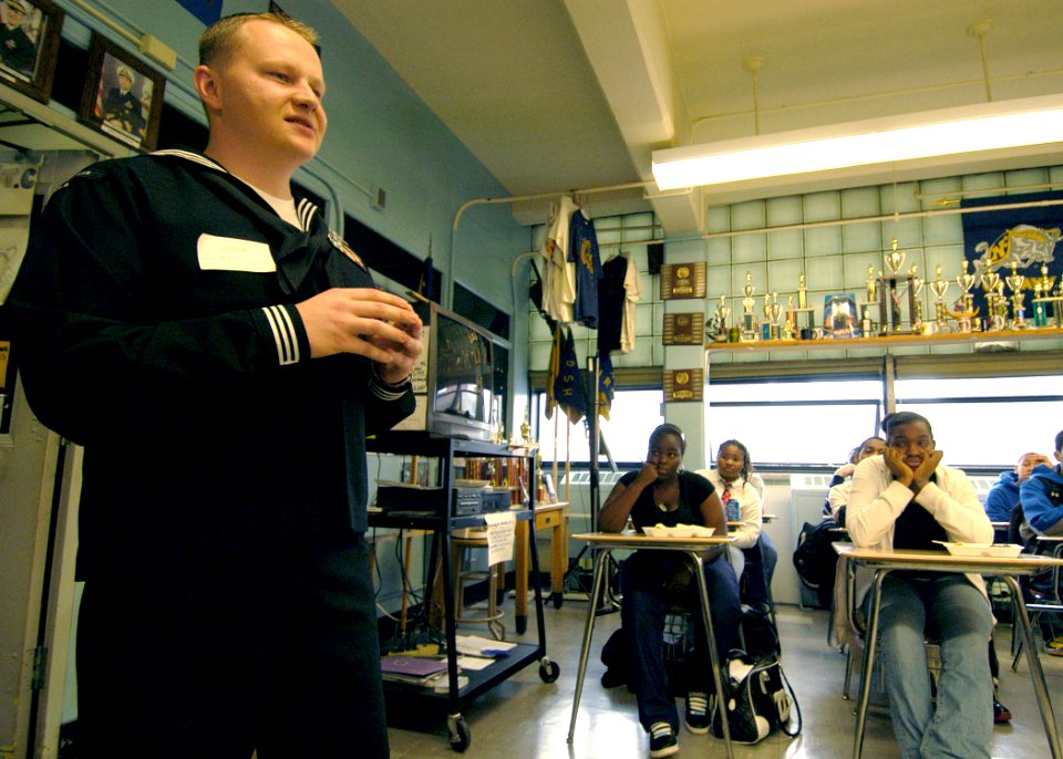 US Navy 081106-N-2636M-040 Intelligence Specialist 1st Class Wesley Gordon, from Carrollton, Ga., a Sailor from the amphibious assault ship USS Bataan (LHD 5), speaks about Navy customs to Navy Junior Reserve Officer Training C