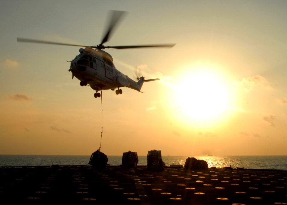 US Navy 081101-N-9134V-152 An SA-330 Puma helicopter delivers cargo during a vertical replenishment with the amphibious dock landing ship USS Carter Hall (LSD 50)