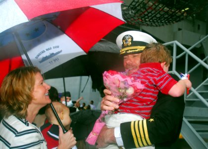 US Navy 081104-N-5148B-048 Capt. Jon Padfield meets his family on the pier following a six-month deployment