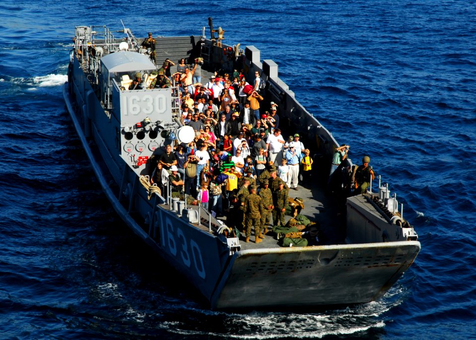 US Navy 081103-N-2183K-034 A landing craft utility enters the well deck of the amphibious assault ship USS Peleliu (LHA 5) with civilians participating in the Western Pacific 2008 Tiger Cruise
