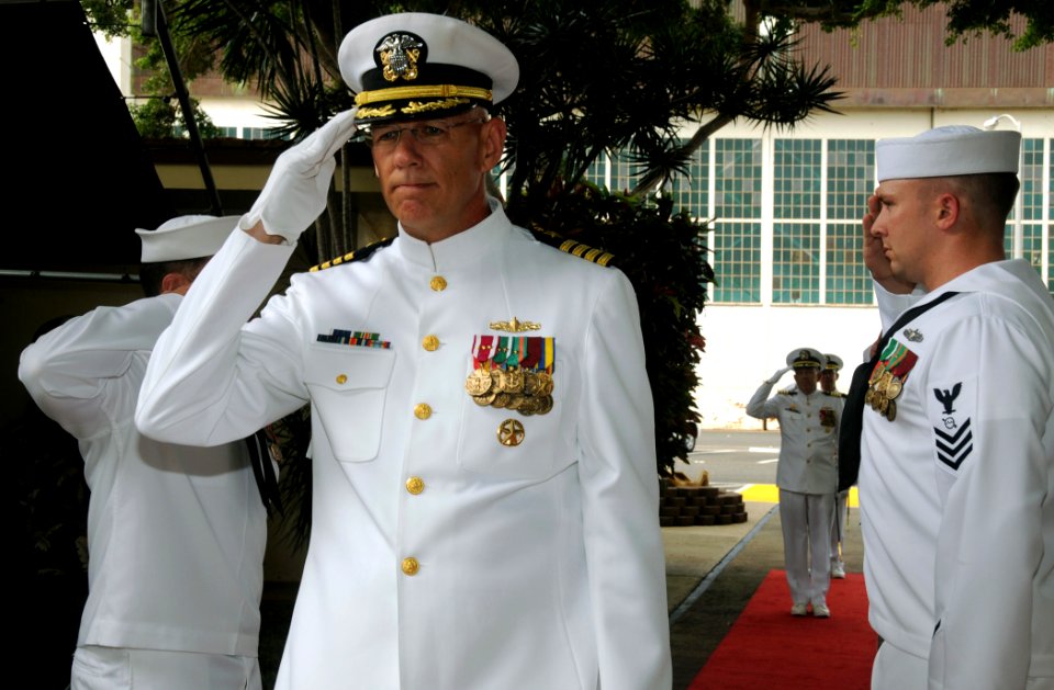 US Navy 081030-N-9758L-006 Capt. Ricks Polk salutes as he is piped through sideboys