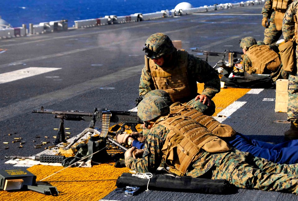 US Navy 081104-N-4774B-294 Chaplain Lt. Russel Martin fires a 240-B automatic weapon