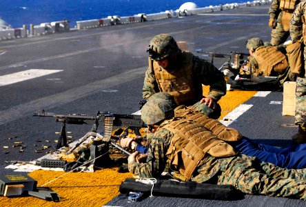 US Navy 081104-N-4774B-294 Chaplain Lt. Russel Martin fires a 240-B automatic weapon