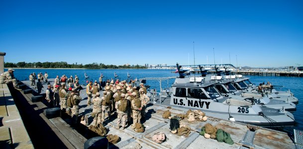 US Navy 081107-N-6932B-468 Crew members of Boat Division 56, a detachment of Maritime Expeditionary Security Squadron (MESRON) 1 return pier side from a simulated escort of high value asset