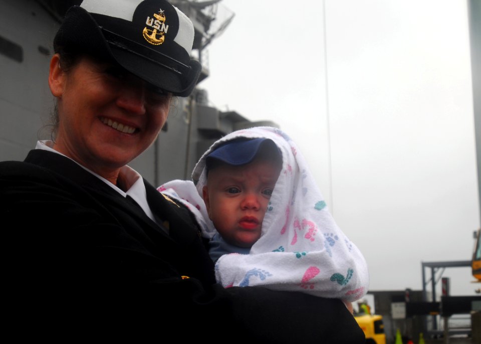 US Navy 081104-N-5148B-064 Senior Chief Master-At-Arms Katherine Gutierriez sees her son for the first time after returning from a six-month deployment