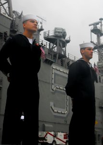 US Navy 081104-N-5148B-002 Sailors man the rails upon their return to homeport