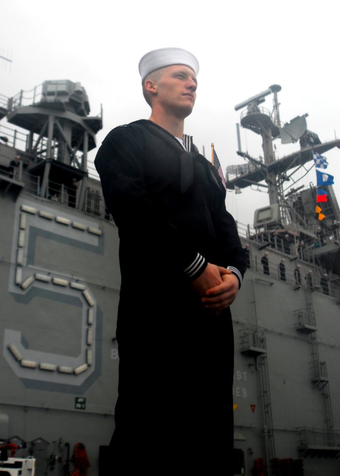 US Navy 081104-N-5148B-004 Sailors man the rails upon their return to homeport
