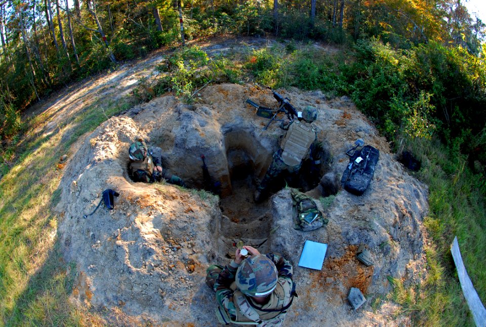 US Navy 081104-N-7367K-011 Seabees assigned to Naval Mobile Construction Battalion (NMCB) 1 keep guard the protective lines from a fighting position at forward operating base zero