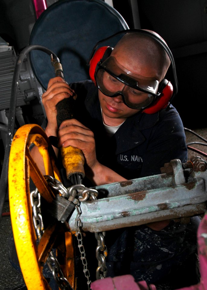 US Navy 081105-N-4236E-028 Seaman Apprentice Jacob Halfen performs corrosion preventative maintenance aboard the multi-purpose amphibious assault ship USS Iwo Jima (LHD 7)