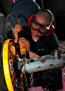US Navy 081105-N-4236E-028 Seaman Apprentice Jacob Halfen performs corrosion preventative maintenance aboard the multi-purpose amphibious assault ship USS Iwo Jima (LHD 7)