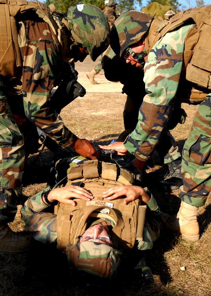 US Navy 081106-N-3857R-002 Seabees assigned to the Naval Mobile Construction Battalion (NMCB) 1 quick reaction force act as litter bearers during a mass casualty drill