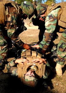 US Navy 081106-N-3857R-002 Seabees assigned to the Naval Mobile Construction Battalion (NMCB) 1 quick reaction force act as litter bearers during a mass casualty drill