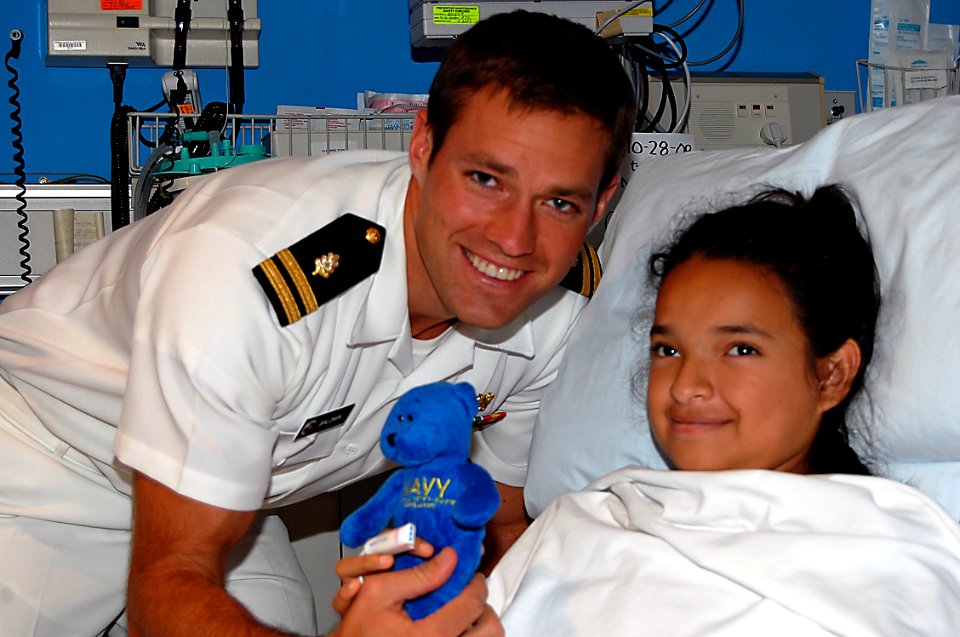 US Navy 081106-N-8390S-016 Lt. Andrew Baldwin, M.D., assigned to the Navy Bureau of Medicine and Surgery, makes this patient and honorary Sailor at Shriners Hospital Houston