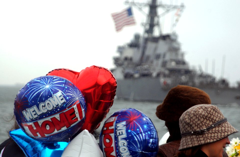 US Navy 081106-N-1688B-025 Friends and family wait on the pier for the Sailors aboard the guided-missile destroyer USS McFaul (DDG 74)