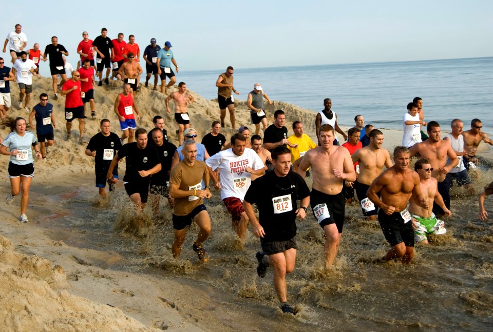 US Navy 090808-N-7874H-082 Runners slosh through the water pit during the Naval Amphibious Base Little Creeks 9th annual Mud Run