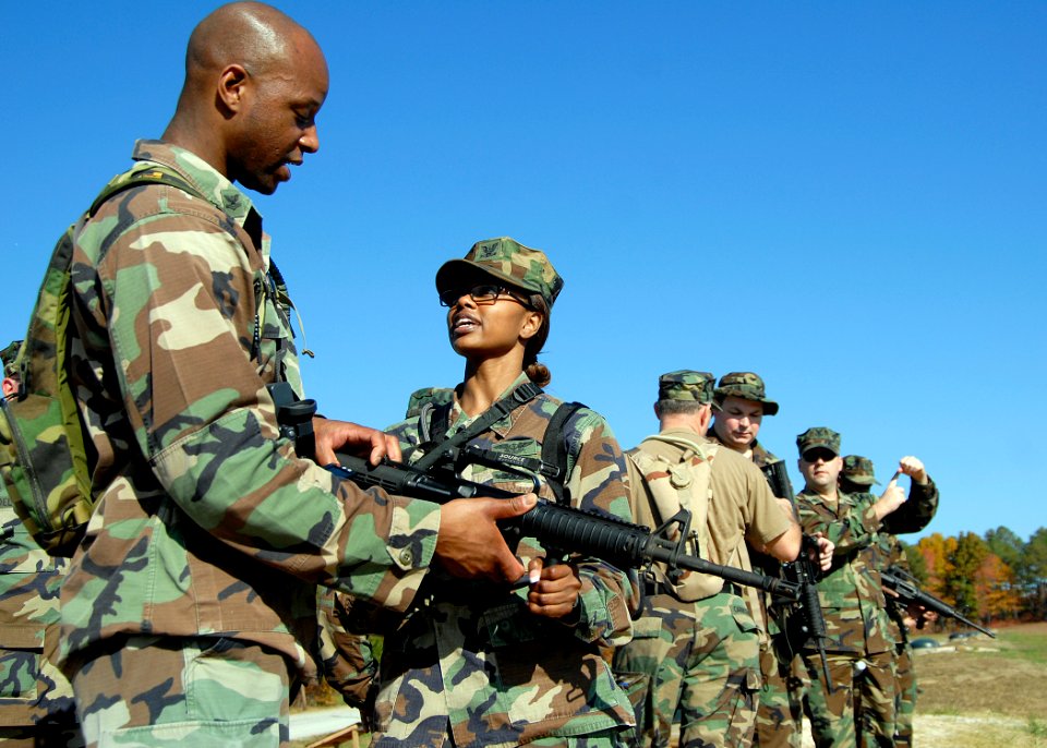US Navy 081107-N-0194K-109 Mass Communication Specialist 2nd Class Ja'lon Rhinehart teaches Yeoman 2nd Class Rosilyn Bowie M16 rifle fundamentals