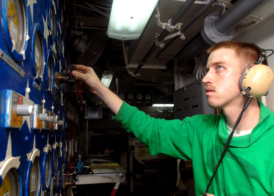 US Navy 081104-N-2456S-100 Aviation Boatswain's Mate (Equipment) 2nd Class Kevin Heaton, from Atkins, Ark., adjusts the air pressure on the central target panel of catapult four aboard aircraft carrier USS Theodore Roosevelt (C