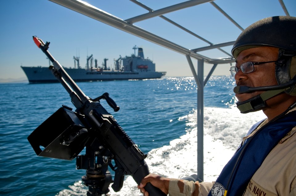 US Navy 081107-N-6932B-203 Engineman 2nd Class Kpaku Palay assigned to Boat Division 56, a detachment of Maritime Expeditionary Security Squadron (MESRON) 1, serves as aft lookout during a simulated escort