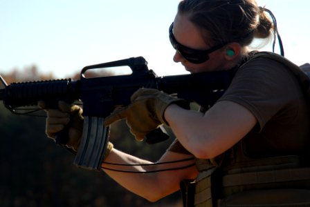 US Navy 081107-N-0411D-012 Mass Communication Specialist 2nd Class Laura Moore fires an M4 rifle during quarterly training for Naval Expeditionary Combat Command Detachment Combat Camera, Norfolk