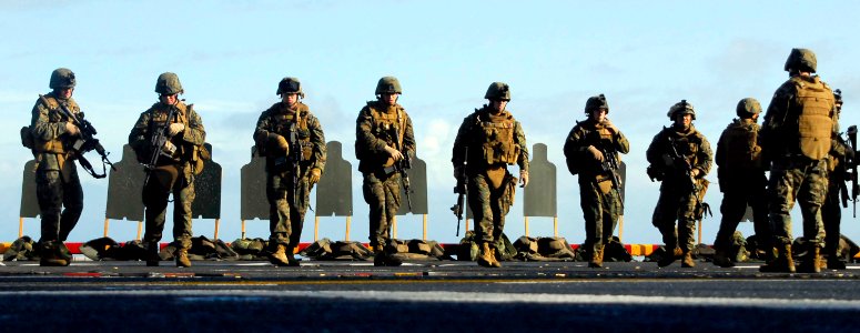 US Navy 081104-N-4774B-368 Marines assigned to the 13th Marine Expeditionary Unit participate in small arms training on the flight deck of the amphibious assault ship USS Boxer (LHD 4)