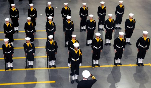 US Navy 081107-N-8848T-043 Chief of Naval Operations (CNO) Adm. Gary Roughead salutes a recruit drill team