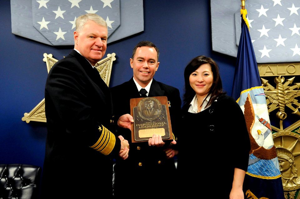 US Navy 081104-N-8273J-059 Chief of Naval Operations (CNO) Adm. Gary Roughead honors Cmdr. Paul J. Lyons, along with wife, Kanako, with the Vice Adm. James B. Stockdale Leadership Award