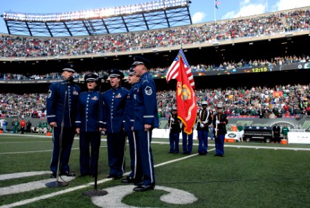 US Navy 081109-N-9818V-189 Members of the United States Air Force sing the National Anthem at the Meadowlands before the NFL game between the New York Jets and St. Louis Rams photo