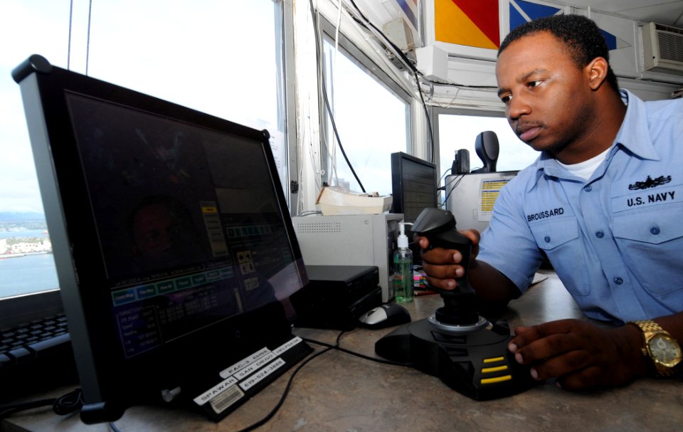 US Navy 081104-N-9758L-048 Quartermaster 3rd Class Karlo Broussard checks the safety of Pearl Harbor using the emergency harbor security system in the Naval Station Pearl Harbor Signal Control Tower