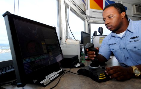 US Navy 081104-N-9758L-048 Quartermaster 3rd Class Karlo Broussard checks the safety of Pearl Harbor using the emergency harbor security system in the Naval Station Pearl Harbor Signal Control Tower
