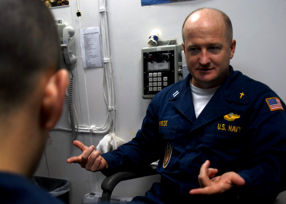 US Navy 081105-N-9900B-003 Command Chaplain Lt. Richard Wiese counsels a Sailor aboard the guided-missile cruiser USS Monterey (CG 61)