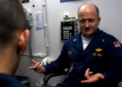 US Navy 081105-N-9900B-003 Command Chaplain Lt. Richard Wiese counsels a Sailor aboard the guided-missile cruiser USS Monterey (CG 61)