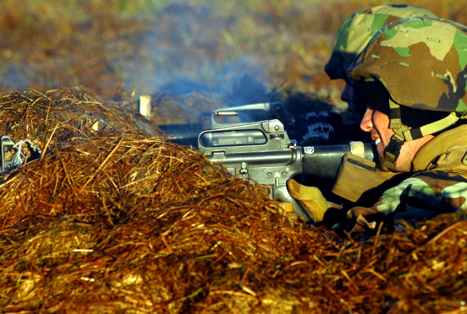US Navy 081108-N-7367K-009 Seabees assigned to Naval Mobile Construction Battalion (NMCB) 1 return fire to aggressors attempting to overrun forward operating base 1