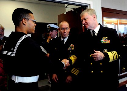 US Navy 081107-N-8273J-267 Chief of Naval Operations (CNO) Adm. Gary Roughead congratulates Sailors at the conclusion of the graduation ceremony for 956 Sailors at the Recruit Training Command