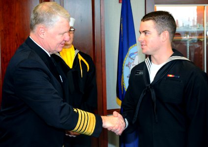 US Navy 081107-N-8848T-109 Chief of Naval Operations Adm. Gary Roughead congratulates honor graduate Seaman Recruit Carl Walter, from LaGrange, Ohio, at Recruit Training Command