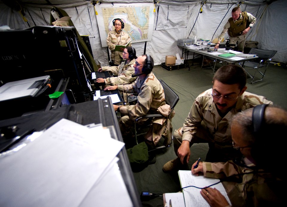 US Navy 081109-N-6932B-091 Communications personnel from Maritime Expeditionary Security Squadron (MESRON) 1 man a simulated maritime operations center (MOC), pier side on Naval Amphibious Base Coronado