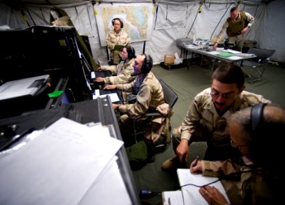 US Navy 081109-N-6932B-091 Communications personnel from Maritime Expeditionary Security Squadron (MESRON) 1 man a simulated maritime operations center (MOC), pier side on Naval Amphibious Base Coronado photo