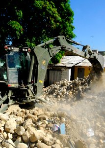 US Navy 100128-N-5244H-077 A Seabee removes rubble from a collapsed church in Baie De Grand Grove, Haiti
