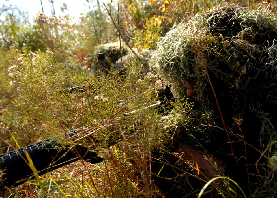 US Navy 081110-N-3674H-093 Gunner's Mate 3rd Class Bryan Silveri and Builder 3rd Class Loren Starkey, both assigned to Naval Mobile Construction Battalion (NMCB) 74, lay in wait for an ambush