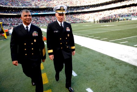 US Navy 081109-N-9818V-660 Master Chief Petty Officer of the Navy Joe R. Campa Jr. and Rear Adm. Terence E. McKnight walk along the sidelines at the Meadowlands