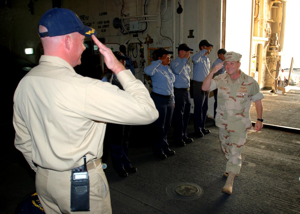 US Navy 081112-N-0803S-002 Cmdr. Kurt Kastner, commanding officer of the amphibious transport dock ship USS San Antonio (LPD 17) greets Adm. Bill Gortney, commander of U.S. Naval Forces Central Command