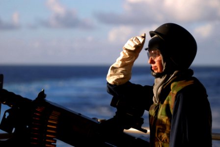 US Navy 081111-N-3610L-336 Aviation Ordnanceman Airman Ashley Ordorica, from Globe, Ariz., sights an incoming target during a live-fire exercise on the fantail of the Nimitz-class aircraft carrier USS Ronald Reagan (CVN-76) photo