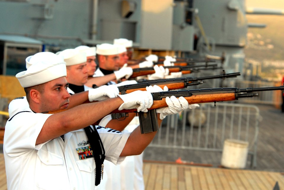 US Navy 081111-N-5476H-075 Members of the Navy Region Hawaii Ceremonial Guard fire a 21-gun salute during a Veterans Day sunset service aboard the Battleship Missouri Memorial