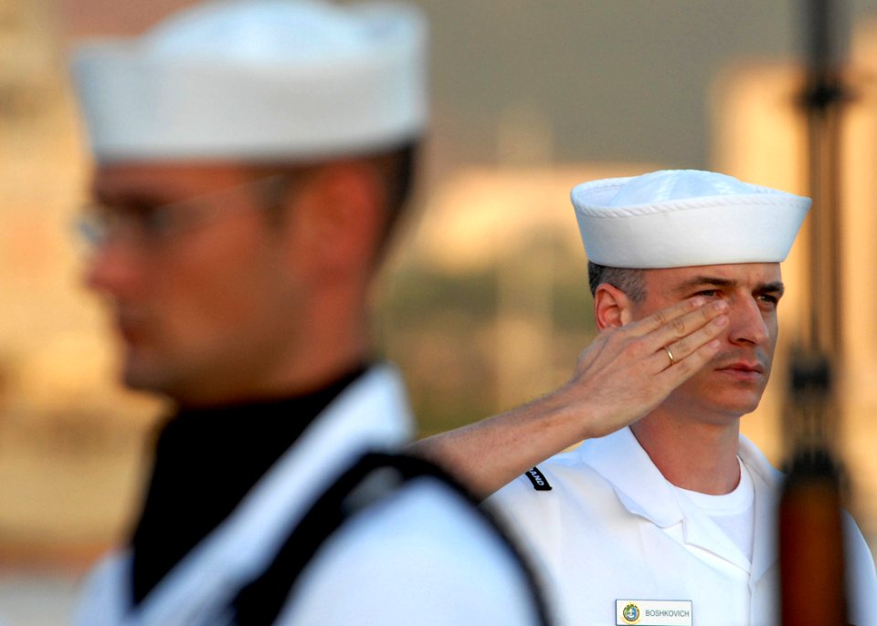 US Navy 081111-N-5476H-101 Musician 3rd Class Ivan Boshkovich renders a salute after playing