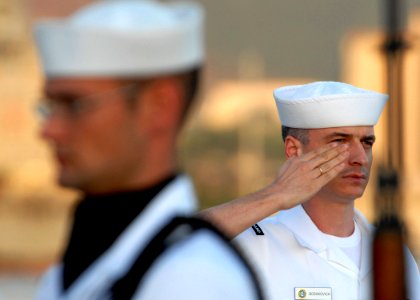 US Navy 081111-N-5476H-101 Musician 3rd Class Ivan Boshkovich renders a salute after playing