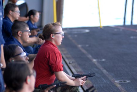 US Navy 081113-N-9132C-097 Aviation Ordnanceman Airman Elise Clover, from Wrightwood, Calif., participates in a live-fire exercise aboard the Nimitz-class aircraft carrier USS Ronald Reagan (CVN 76) photo