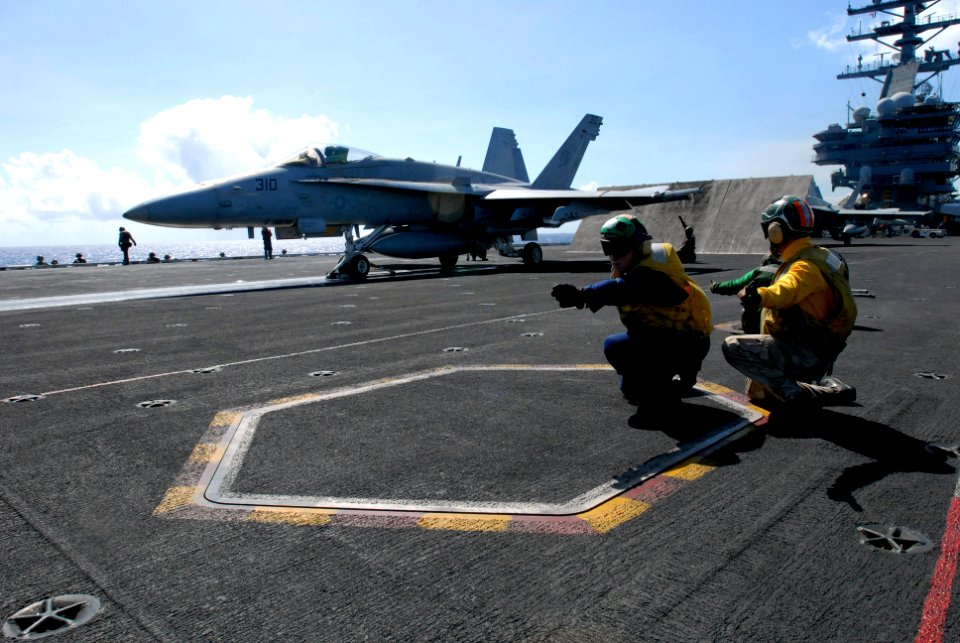US Navy 081111-N-7730P-017 ulinary Specialist Matthew Siteman takes full advantage of winning Shooter for the Day