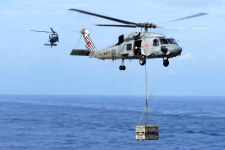 US Navy 081114-N-9132C-154 An aircrewman looks down from a SH-60F Sea Hawk