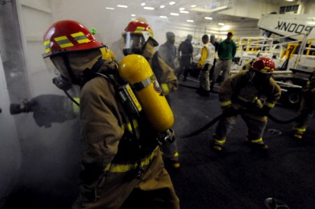 US Navy 081114-N-3659B-521 Sailors battle a simulated class bravo fire