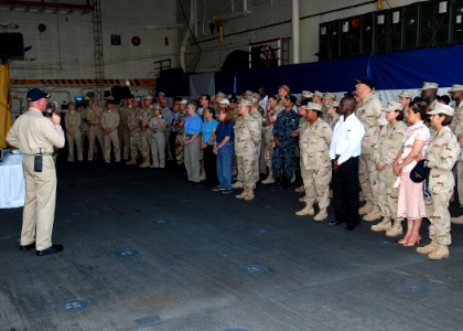 US Navy 081112-N-0803S-005 Cmdr. Kurt Kastner, commanding officer of the amphibious transport dock ship USS San Antonio (LPD 17) describes the capabilities of the ship to a visiting group